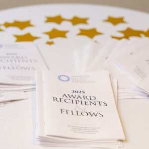 Photo of Awards and Fellows program booklet displayed on table